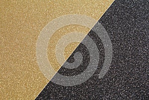 Craft glitter paper in the colours of black & gold.