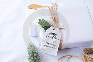 Craft and handmade Christmas present gift boxes with tag.