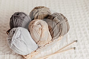 Craft hobby background with yarn in natural colors. Recomforting, destressing hobby