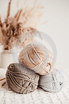 Craft hobby background with yarn in natural colors. Recomforting, destressing hobby