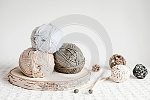 Craft hobby background with yarn in natural colors. Recomforting, destressing hobby