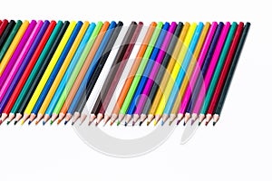 Craft Ideas. Closeup of  Various Colorful Pencils Placed Together in Row. Isolated Against White.Picture made from Upper View