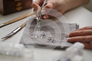 Craft jewelery making with professional tools. A handmade jeweler process, manufacture of jewellery.