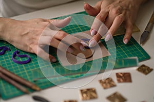 Craft jewelery making with professional tools. A handmade jeweler process, manufacture of jewellery.