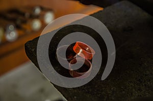 Craft jewelery making with professional tools. Macro shot. A handmade jeweler process, manufacture of jewellery. Melting metal