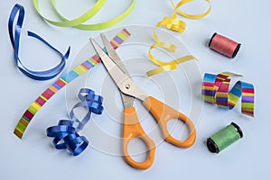 Craft objects such as scissors, ribbon, and thread