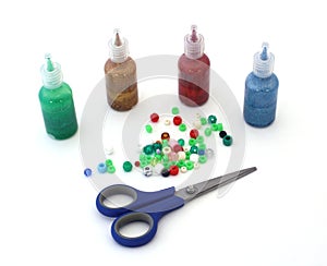 Craft paints, beads, scissors