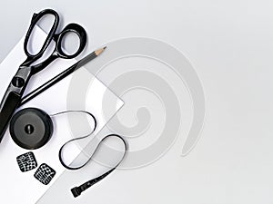 Craft and sewing tools on gray background