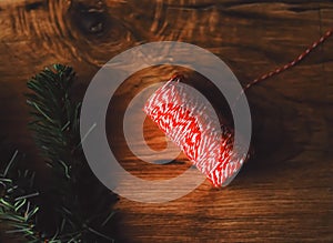 Craft thread and fir tree branch on rustic wooden background, Christmas and boxing day flatlay