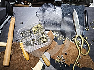 Craft tools and Leather on table top view