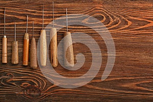 Craft tools for work with leather on wooden table