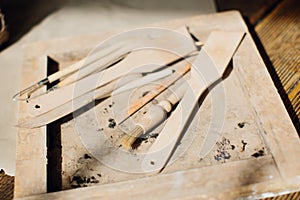 Craft workshop. Tools for clay and ceramics. Wooden objects, tools, spatulas.