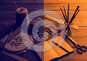 Craft workspace with various tools displayed on a wooden table