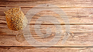 craftbeer glass filled with barley malt photographed from above photo