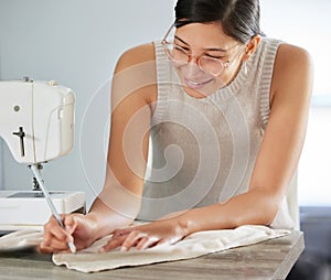 Craftiness is happiness. a young woman designing a garment in her workshop. photo