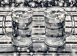 Crafting beer, Two mugs of beer on a wooden table in the pub. New Year, Christmas. Glasses of light beer on a pub background.