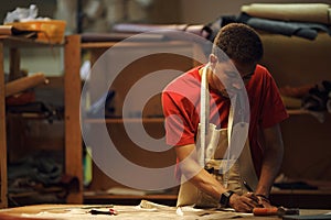 Crafting Leather Goods in Workshop Using Tools photo
