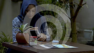 Crafting Serenity: Muslim Women Creating Greeting Cards in an Outdoor Garden Oasis