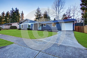 Craftsman blue one-story low-pitched roof home in Tacoma.