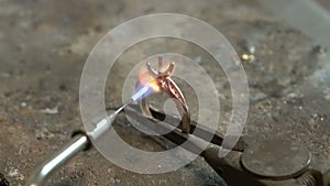 Craftsman diamond welding gold ring. solitaire ring. Diamond ring jewelery product. Close up craftsman