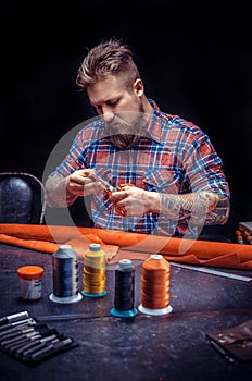 Craftsman focusing on his work at a workshop