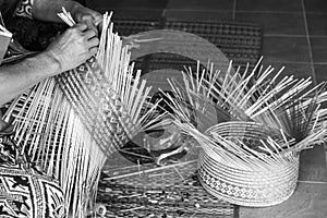 craftsman hands working basketry