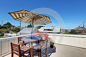 Craftsman house roof top terrace with living area.