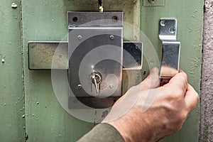 craftsman installs a door lock with deadbolt