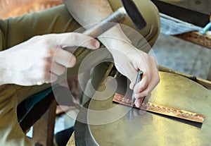 Craftsman makes copper bracelet