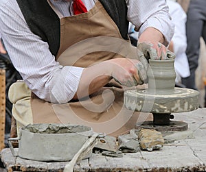 Craftsman potter shaping clay to make a beautiful vase handmade