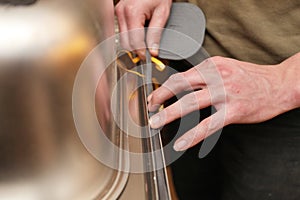 Craftsman putting gasket on the kitchen sink photo