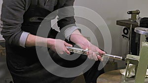 A craftsman recovering blows of a flute