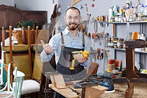 Craftsman repairing antique furniture