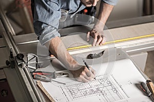 Craftsman's hands on the workbench