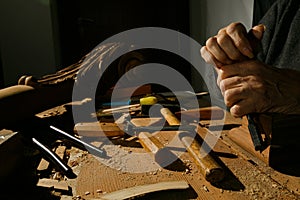 Craftsman& x27;s hands working on wood carving, with gouge and chisel Cabinetmaker, carpentry