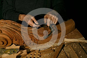 Craftsman& x27;s hands working on wood carving, with gouge and chisel Cabinetmaker, carpentry