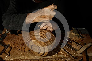 Craftsman& x27;s hands working on wood carving, with gouge and chisel Cabinetmaker, carpentry