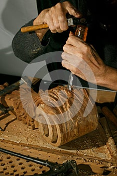 Craftsman& x27;s hands working on wood carving, with gouge and chisel Cabinetmaker, carpentry