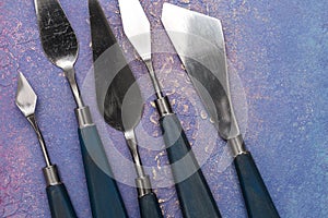 Craftsman`s tools, artistic palette knives of various shapes and sizes