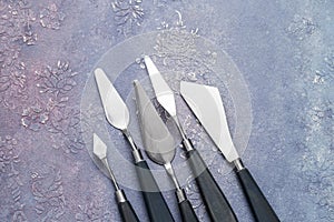 Craftsman`s tools, artistic palette knives of various shapes and sizes