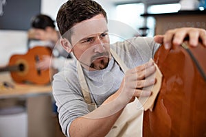 craftsman sanding guitar