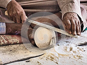 Craftsman shaping alabaster