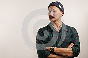 Craftsman standing confidently with his arms folded isolated over white wall.