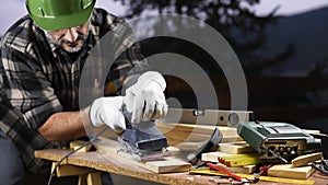 Craftsman at work on wooden boards. Carpentry.