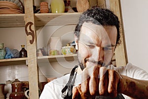 Craftsman working with clay