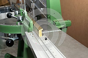 Craftsman working on frame in frameshop.