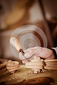 Craftsman working in workshop lutemaker