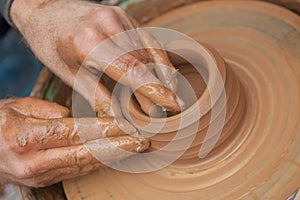 Craftsman works in clay pot