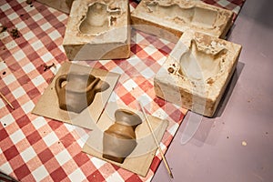 Craftsmanship concept. Clay molding
