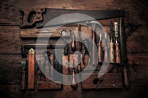 Craftsmanship concept illustrated by collection of old carpentry tools